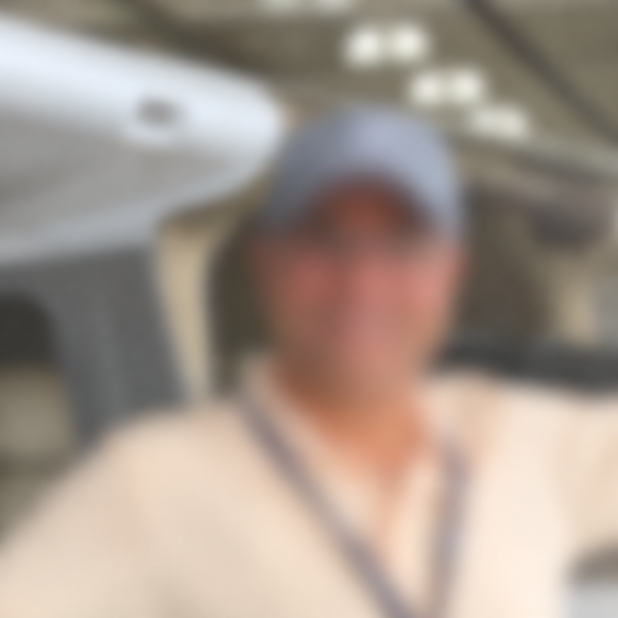 Anonymized portrait of Nxxxxx Pxxxxx with a Cessna aircraft